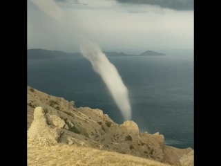 close-up shot of a waterspout on the kara-dag mountain range, crimea. (6 september 2018)